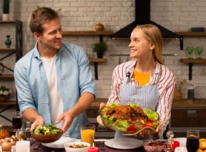 lovely-couple-holding-food-looking-each-other